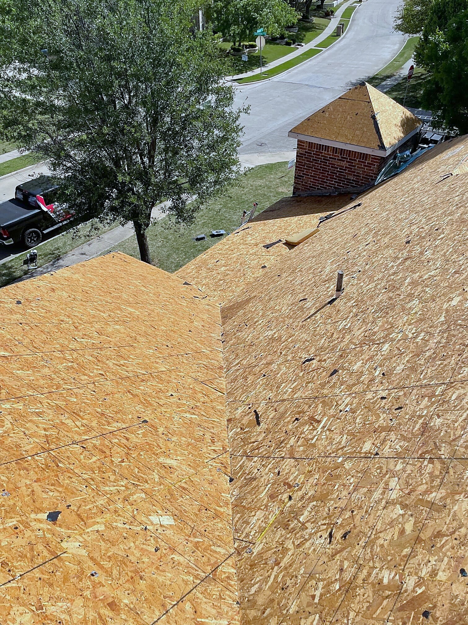 Bare plywood decking on a roof slope before the underlayment goes down